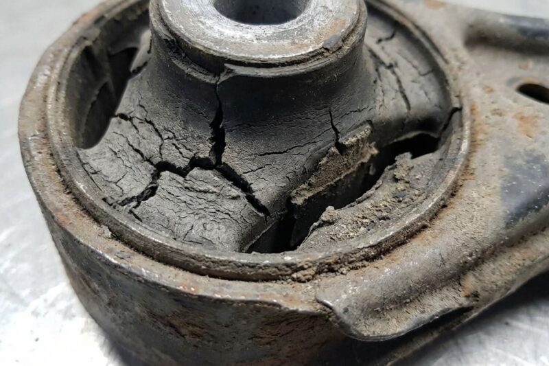 Can hardened rubber in suspension bushings (from age or cold) cause a stiff ride?