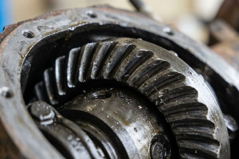Why is there a whining noise from the rear axle at speed? Worn differential gears.